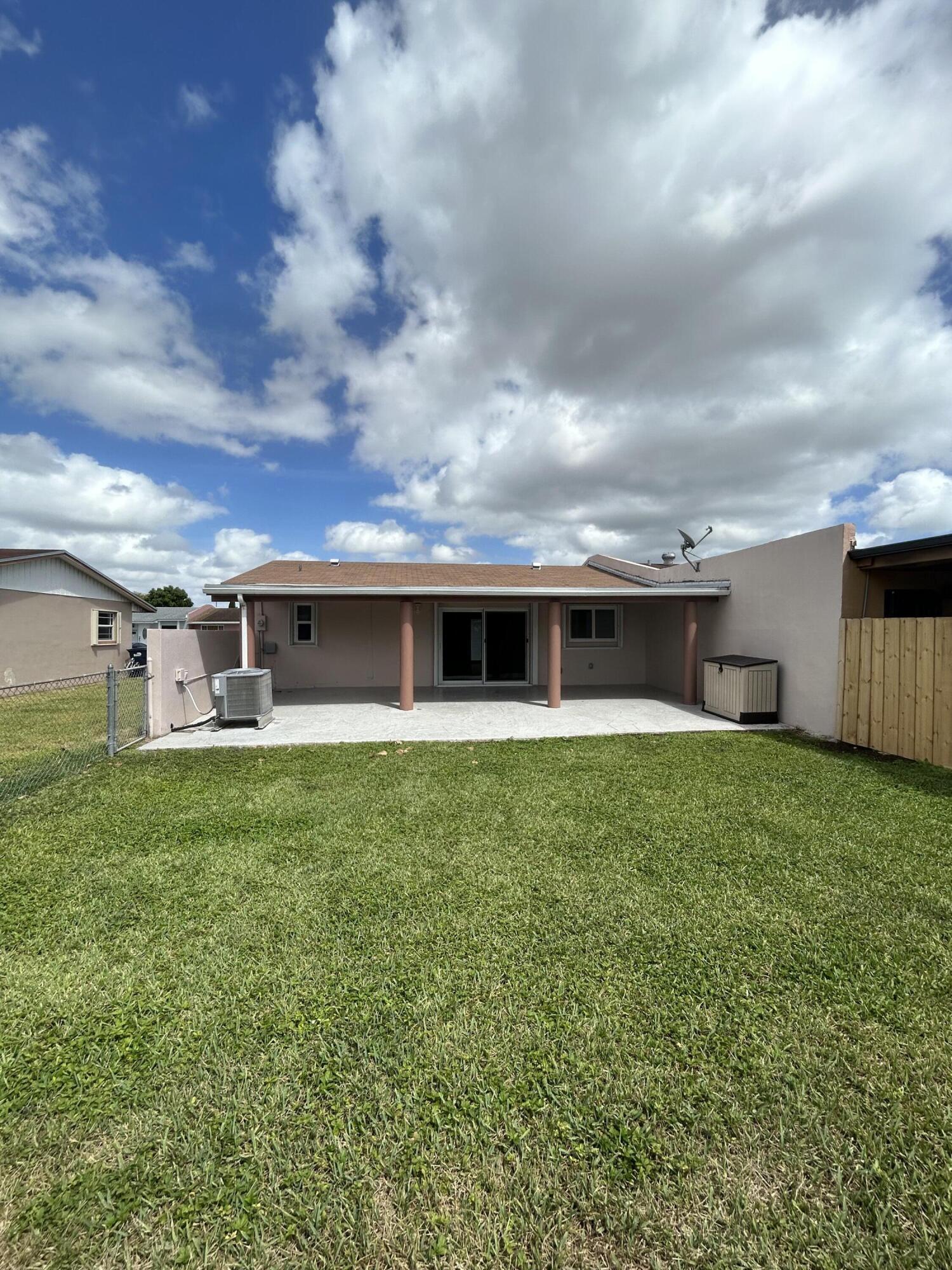 2004 Southwest 131st Place Miami, FL 33175 - Photo 16 of 16 a view of a house with a back yard