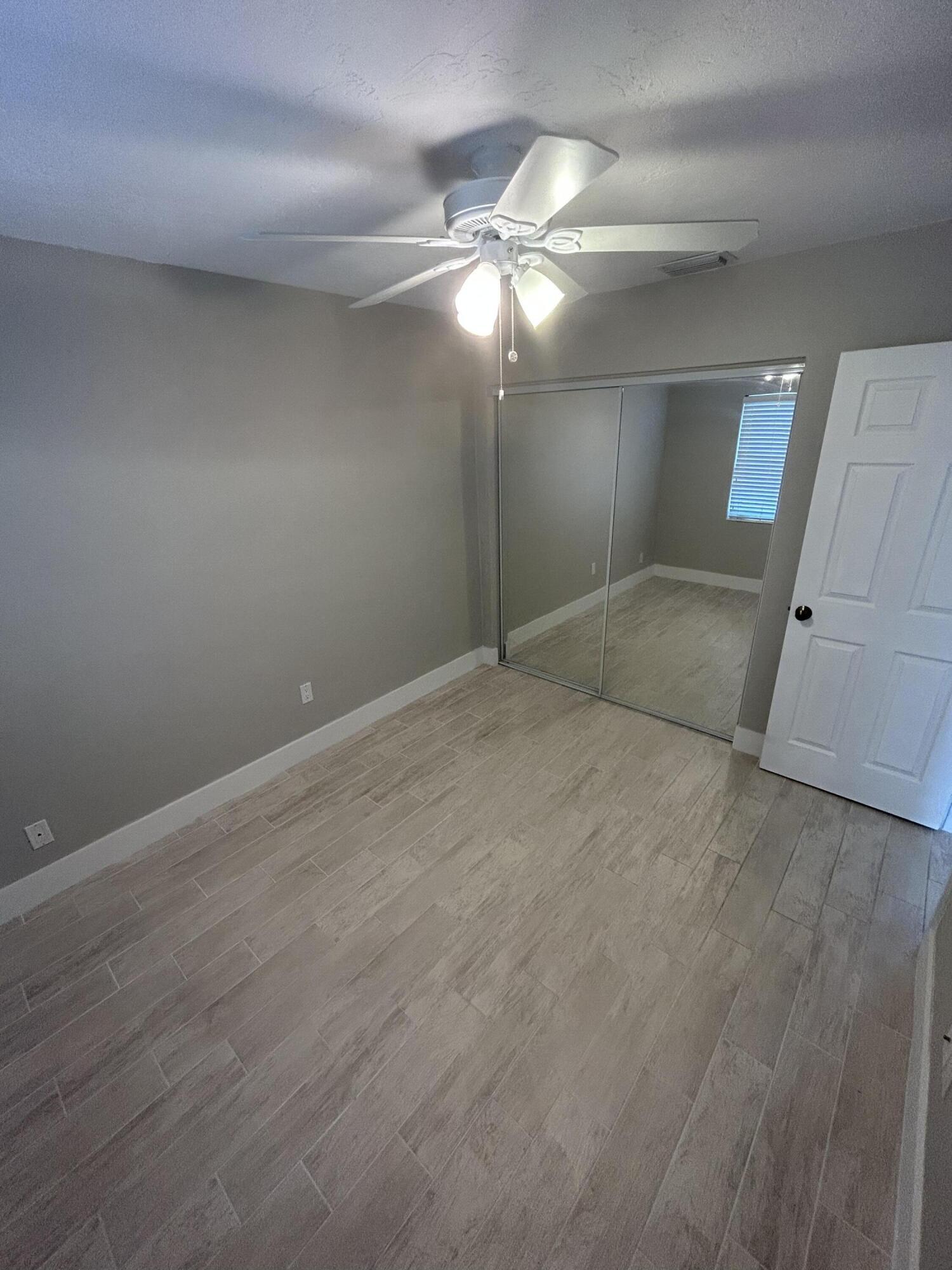 2004 Southwest 131st Place Miami, FL 33175 - Photo 4 of 16 a view of an empty room with a chandelier fan