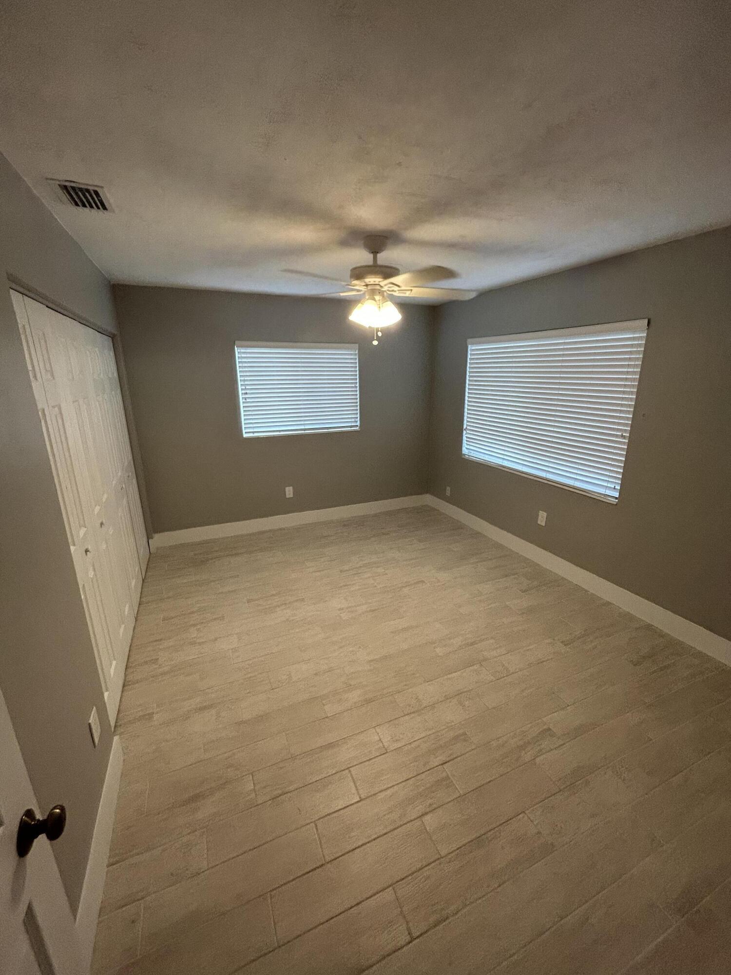 2004 Southwest 131st Place Miami, FL 33175 - Photo 5 of 16 a view of a livingroom with a ceiling fan and window