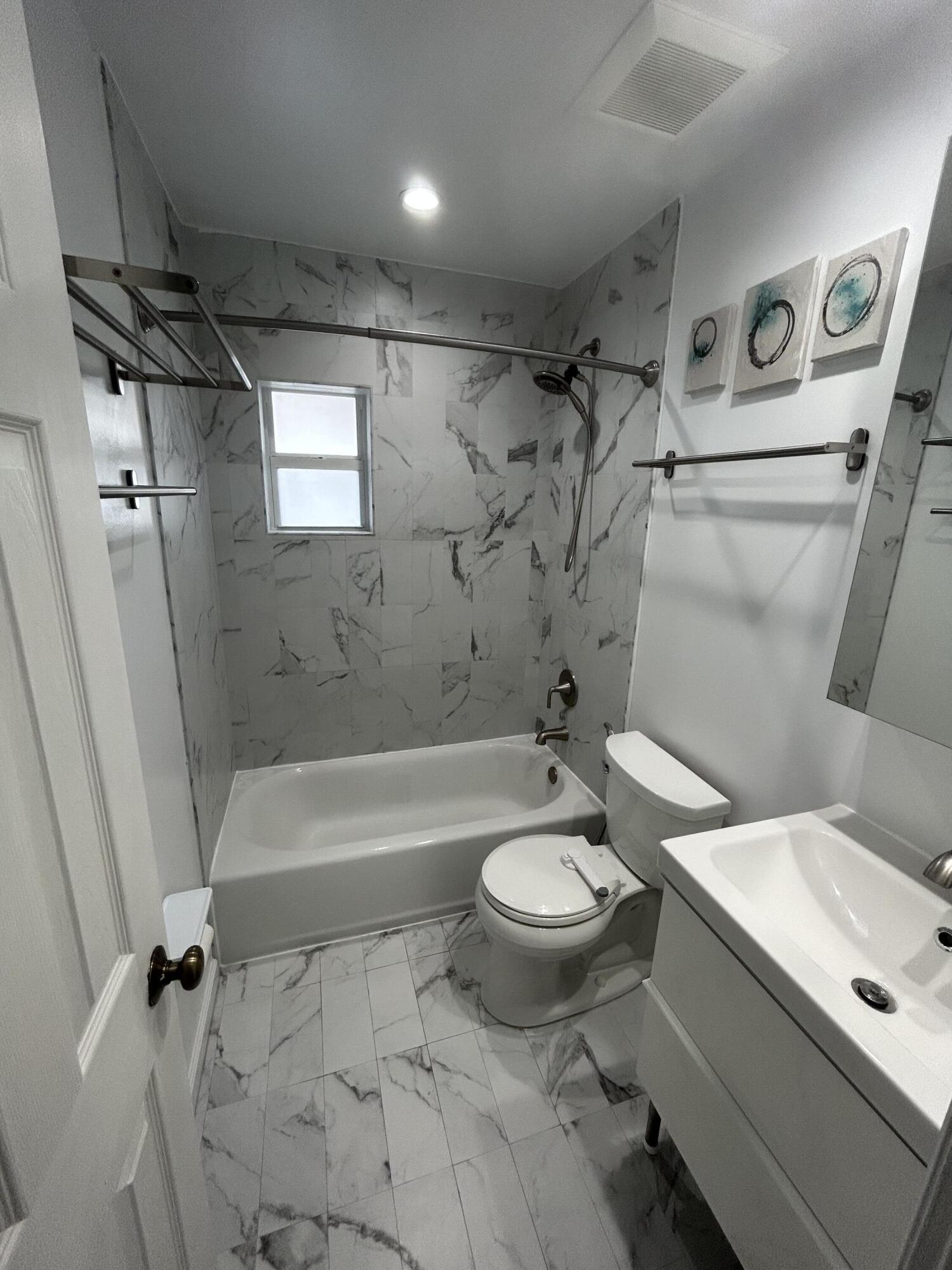 2004 Southwest 131st Place Miami, FL 33175 - Photo 7 of 16 a bathroom with a sink toilet and shower