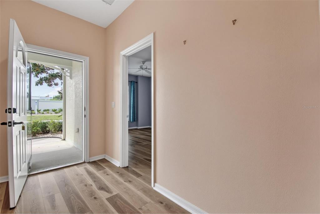33 Summerwind Circle, Unit 101 Palm Coast, FL 32137 - Photo 12 of 45 an empty room with windows