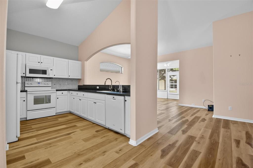 33 Summerwind Circle, Unit 101 Palm Coast, FL 32137 - Photo 20 of 45 a kitchen with cabinets oven and a counter space