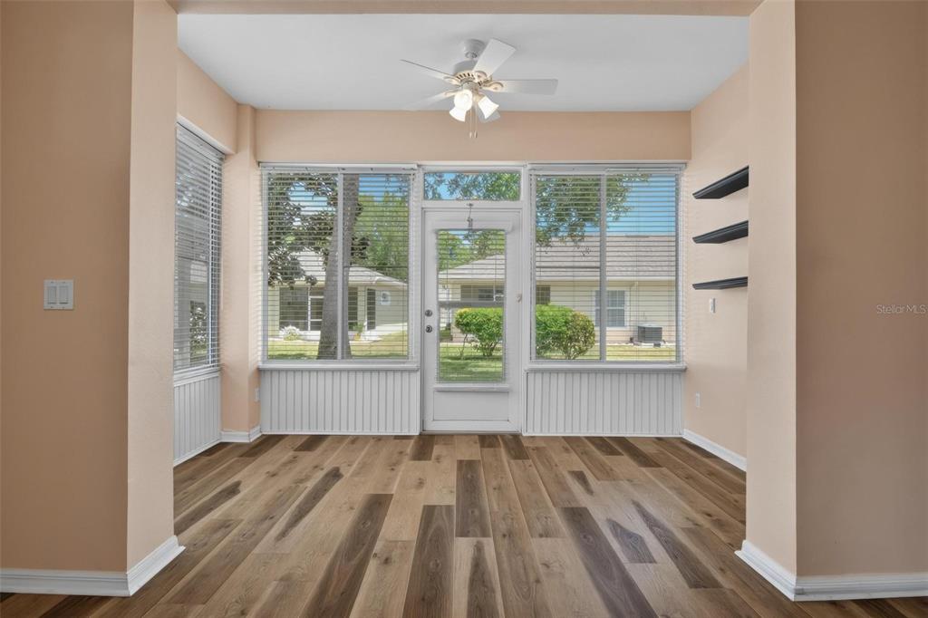 33 Summerwind Circle, Unit 101 Palm Coast, FL 32137 - Photo 24 of 45 a view of empty room with wooden floor and fan