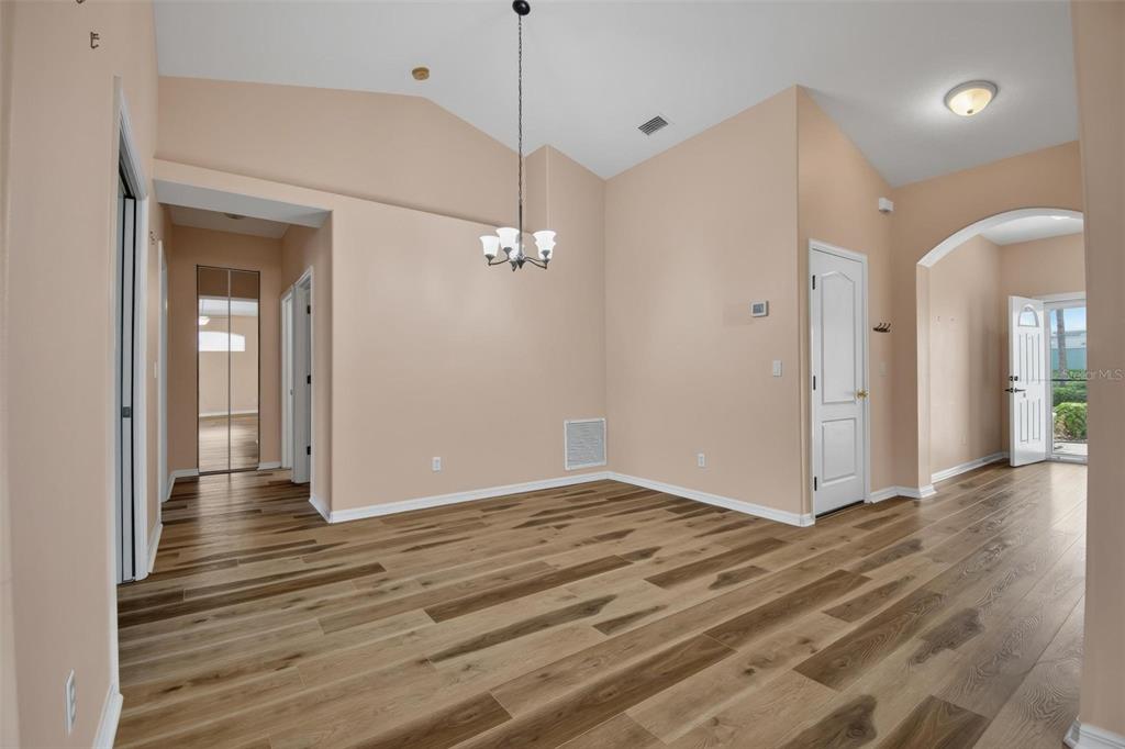 33 Summerwind Circle, Unit 101 Palm Coast, FL 32137 - Photo 27 of 45 a view of an empty room with wooden floor and a window