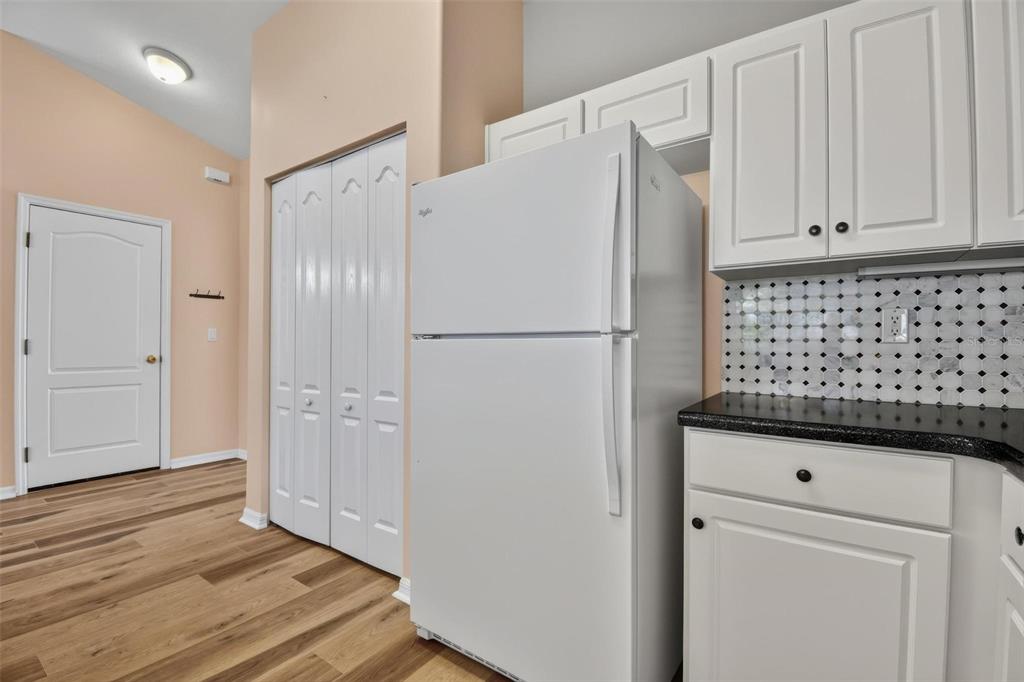 33 Summerwind Circle, Unit 101 Palm Coast, FL 32137 - Photo 30 of 45 a white refrigerator freezer sitting in a kitchen
