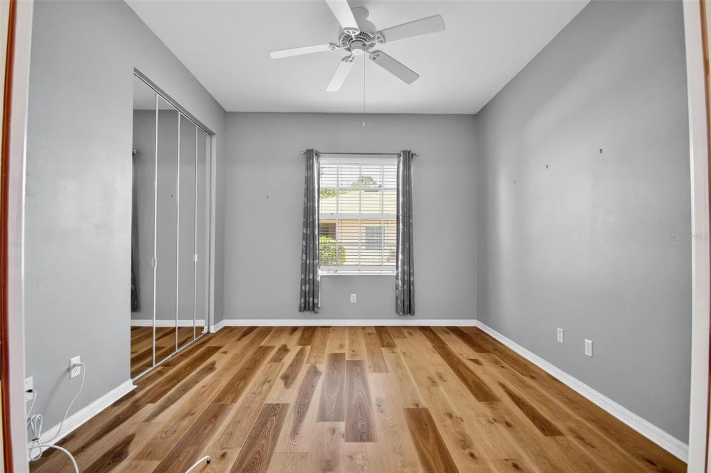 33 Summerwind Circle, Unit 101 Palm Coast, FL 32137 - Photo 35 of 45 a view of a room with wooden floor and cabinet