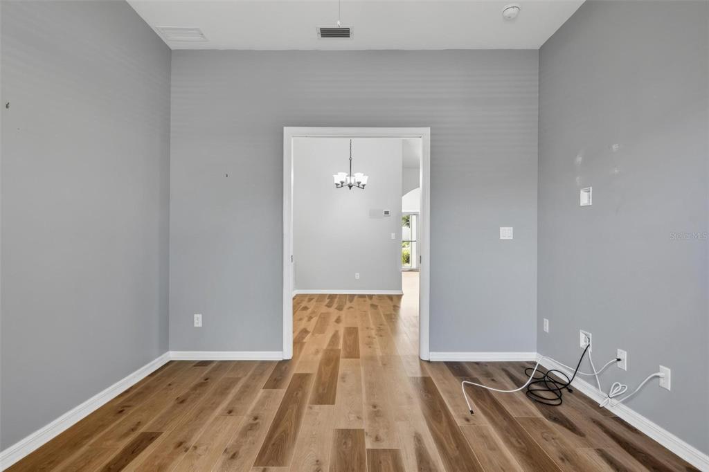 33 Summerwind Circle, Unit 101 Palm Coast, FL 32137 - Photo 36 of 45 a view of a room with wooden floor and staircase