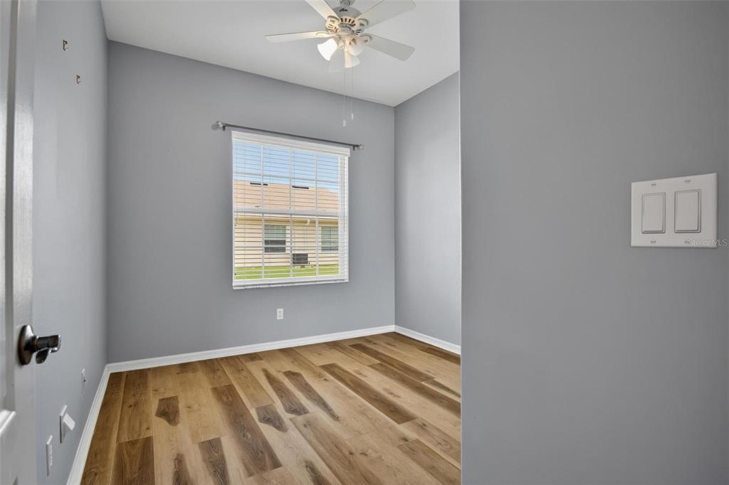 33 Summerwind Circle, Unit 101 Palm Coast, FL 32137 - Photo 38 of 45 a view of room with window and ceiling fan