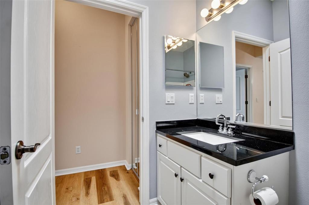 33 Summerwind Circle, Unit 101 Palm Coast, FL 32137 - Photo 41 of 45 a bathroom with a sink and a mirror