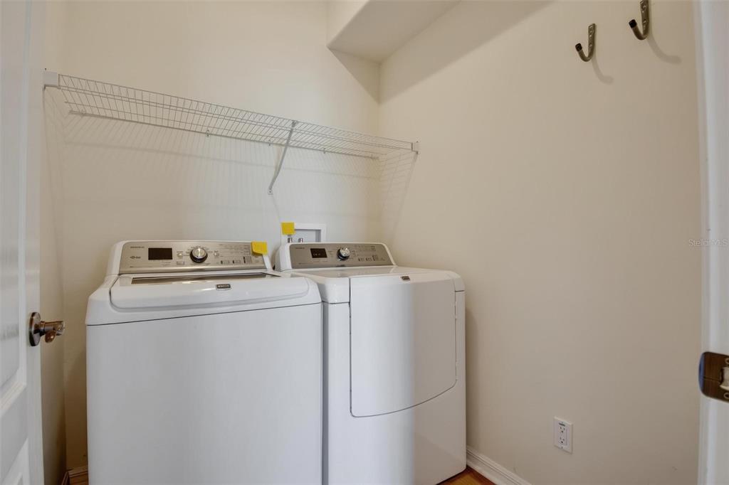 33 Summerwind Circle, Unit 101 Palm Coast, FL 32137 - Photo 42 of 45 a utility room with dryer and washer