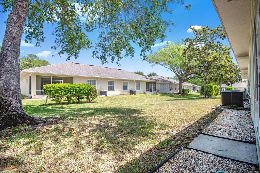 33 Summerwind Circle, Unit 101 Palm Coast, FL 32137 - Photo 43 of 45 a front view of a house with garden