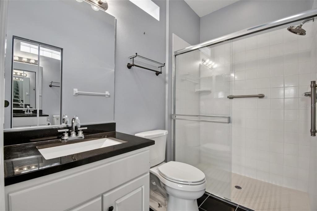 33 Summerwind Circle, Unit 101 Palm Coast, FL 32137 - Photo 5 of 45 a bathroom with a sink and a mirror