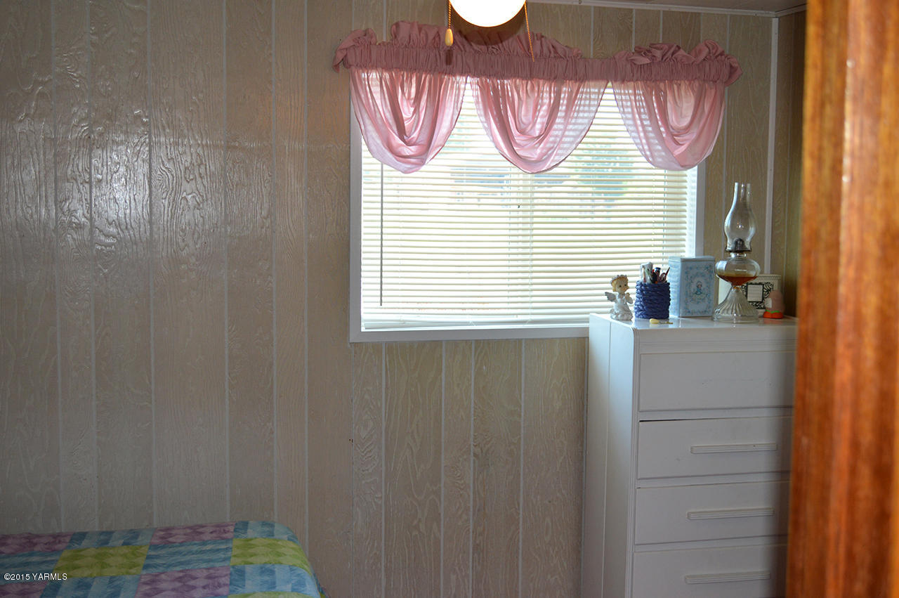 931 Barker Road Granger, WA 98932 - Photo 16 of 22 a bathroom with a sink and a mirror