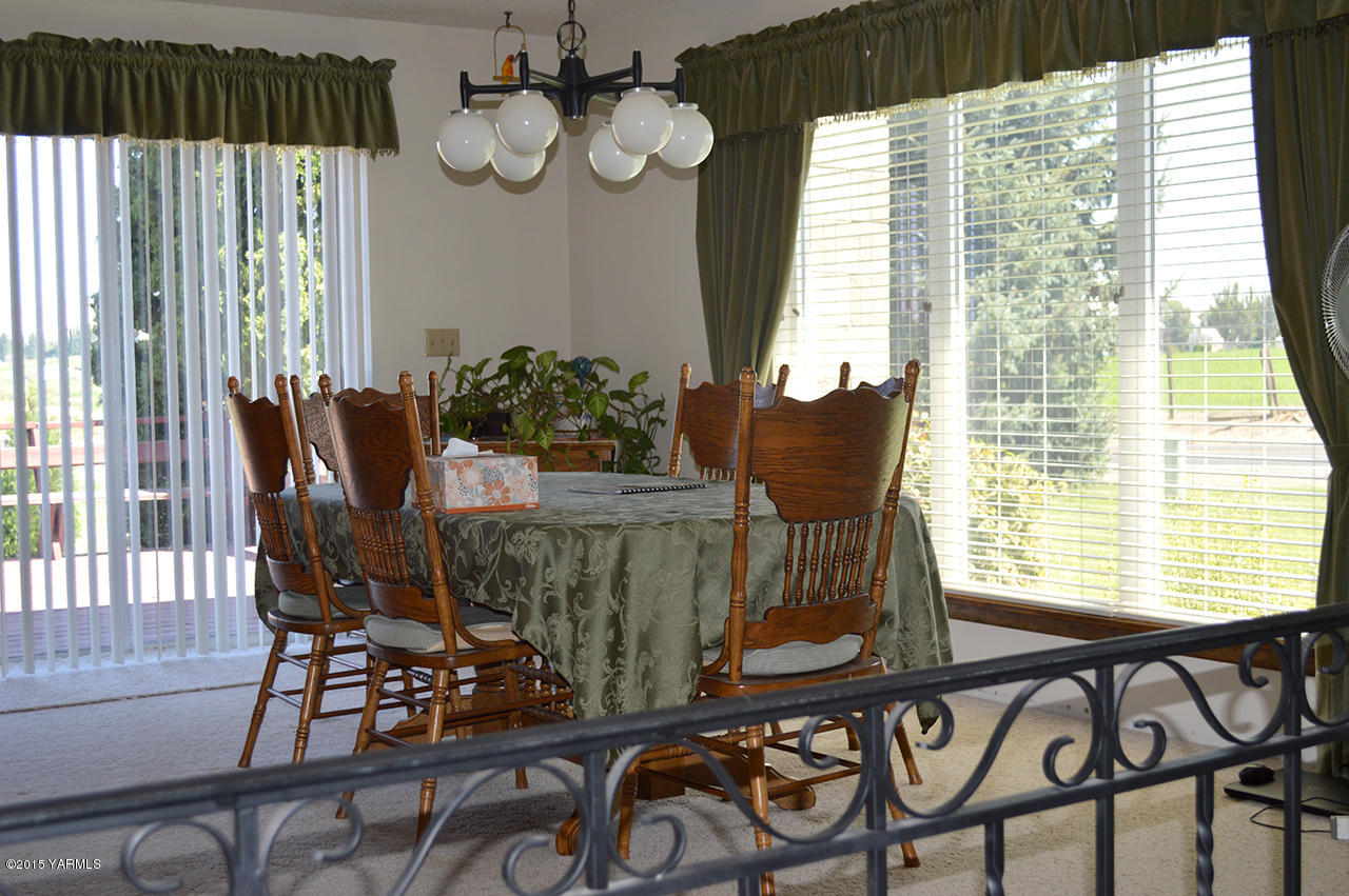931 Barker Road Granger, WA 98932 - Photo 7 of 22 a view of a dining room with furniture window and outside view
