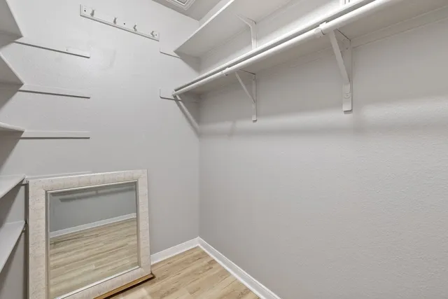 a view of an empty walk in closet