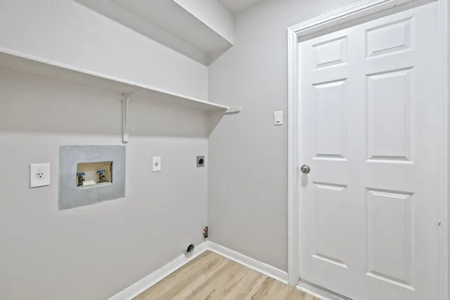 a room with pool table and windows