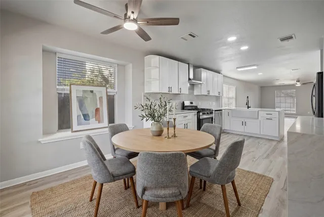 a dining room with furniture and window