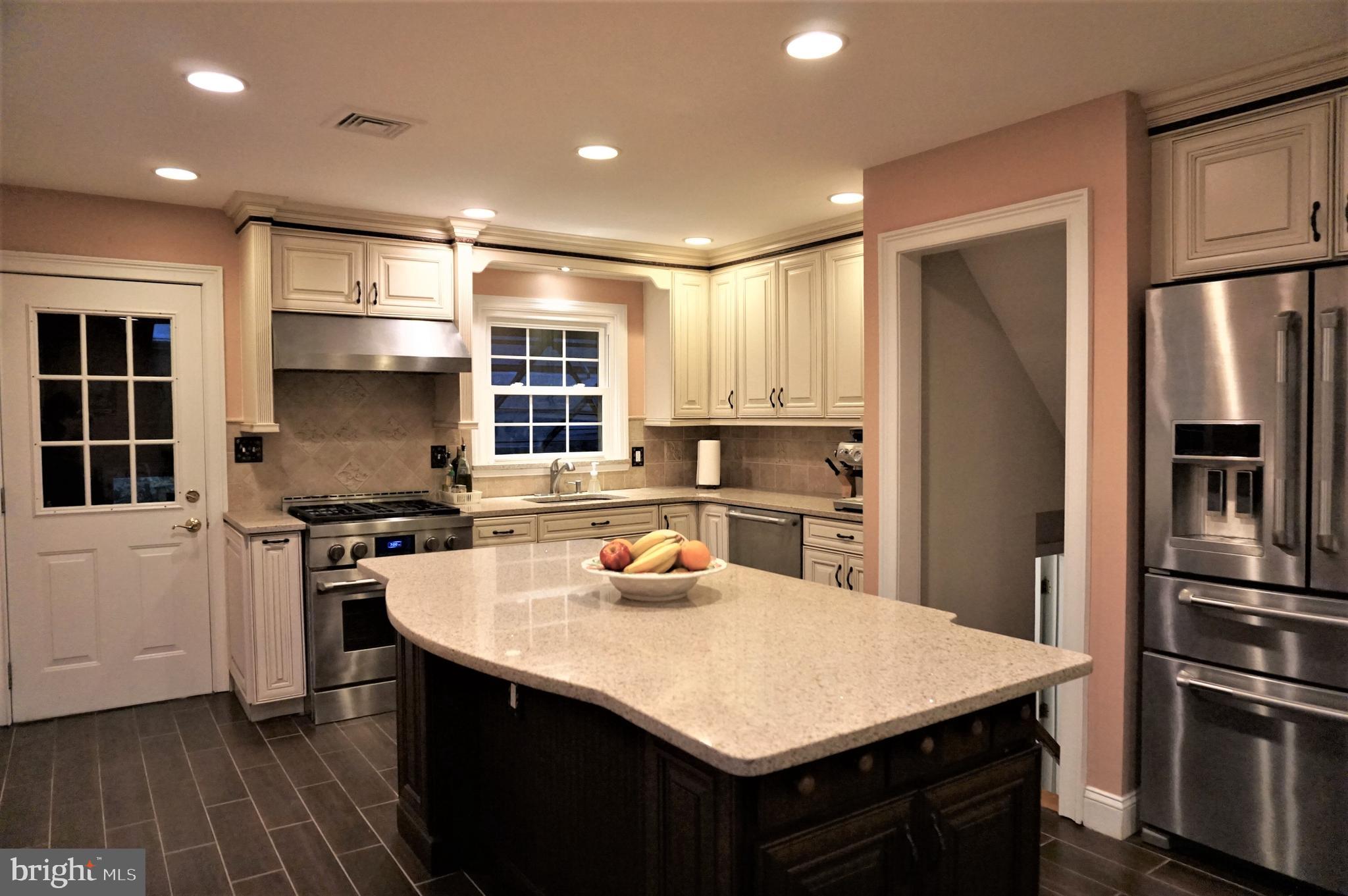 74 Marion Road East Princeton, NJ 08540 - Photo 1 of 32 a kitchen with a refrigerator a sink a stove and cabinets