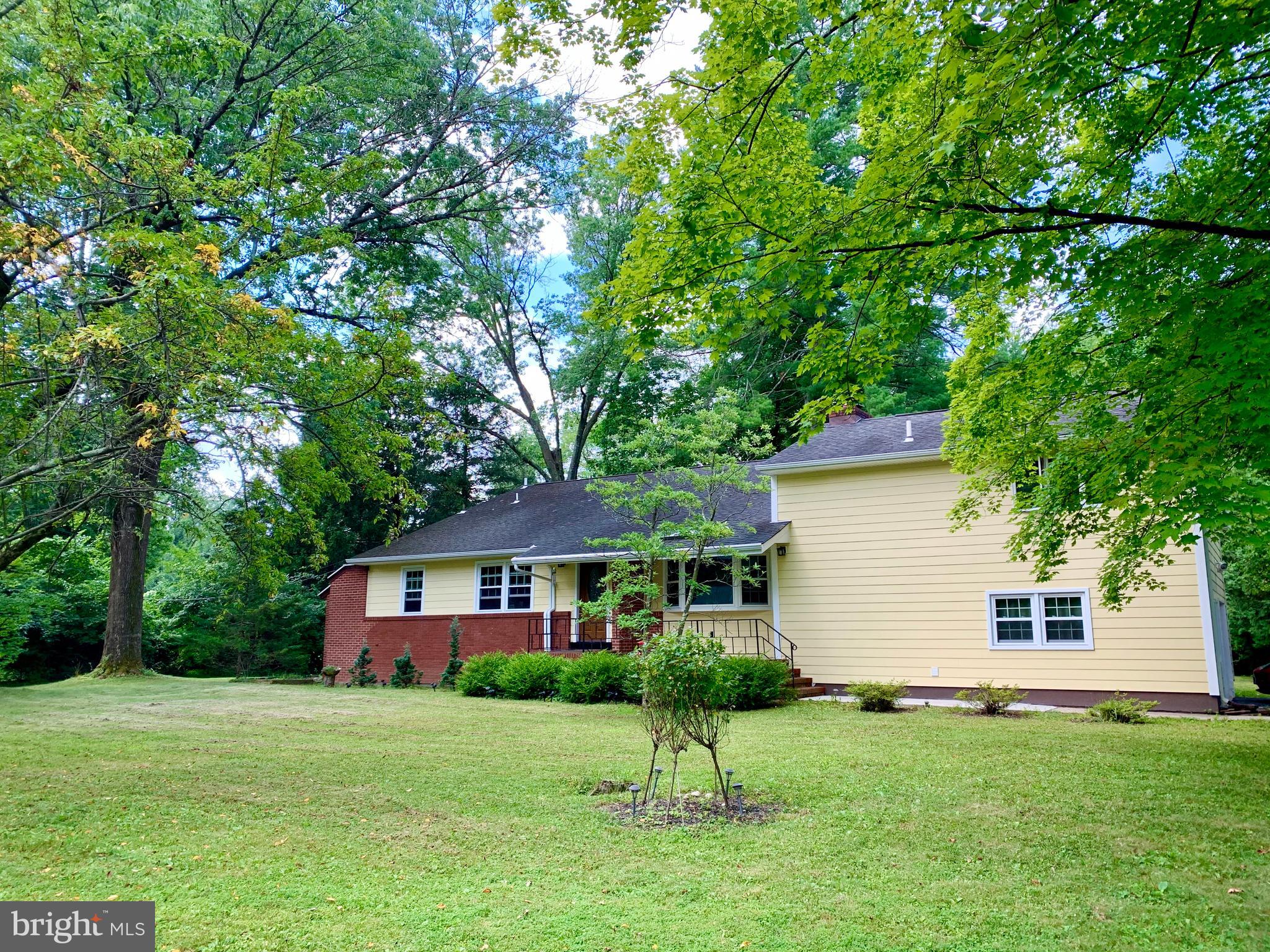 74 Marion Road East Princeton, NJ 08540 - Photo 2 of 32 a front view of a house with a garden