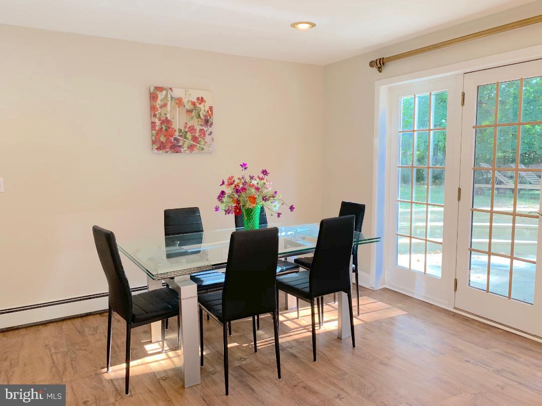 74 Marion Road East Princeton, NJ 08540 - Photo 14 of 32 a dining room with furniture and wooden floor