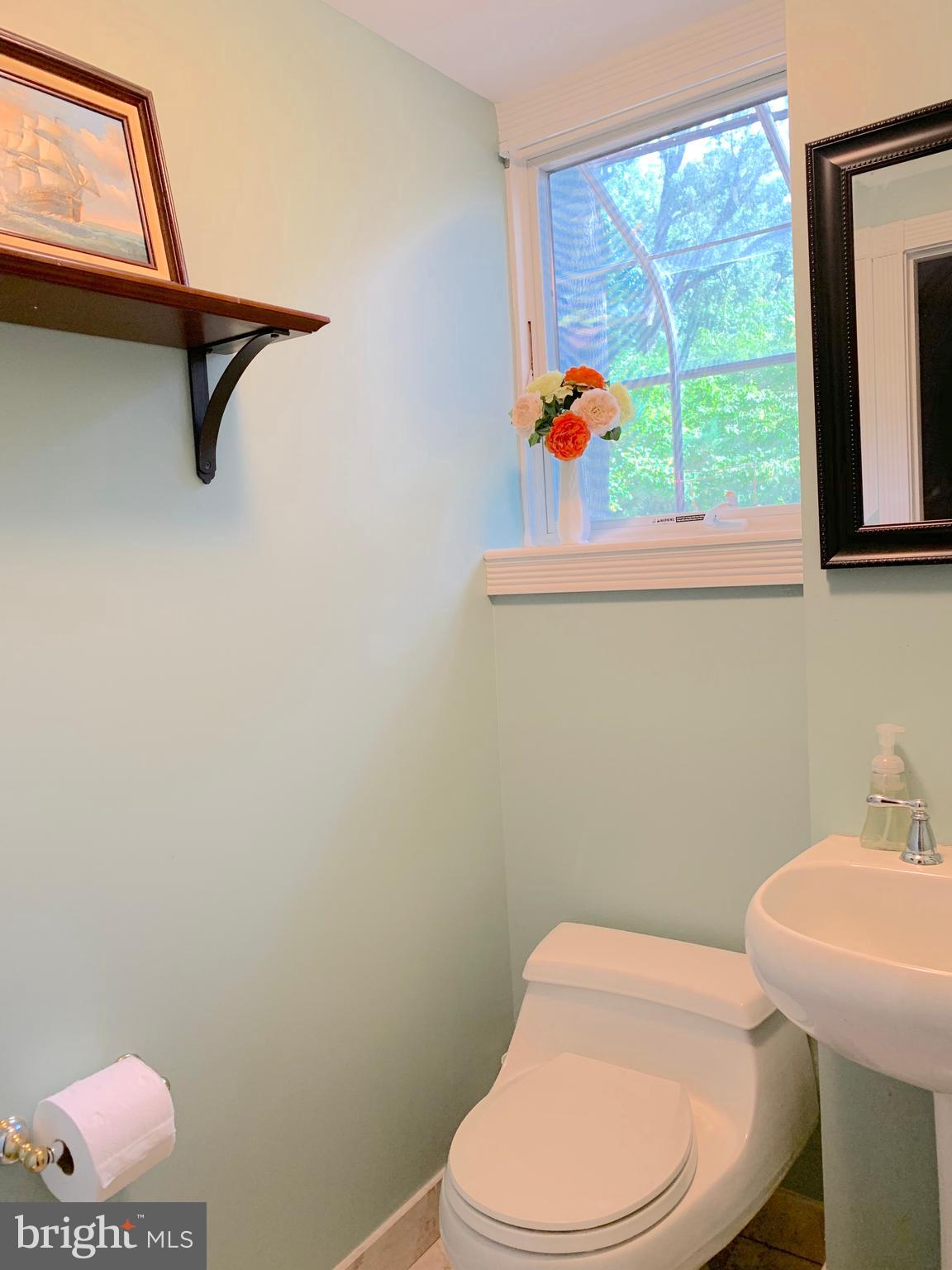 74 Marion Road East Princeton, NJ 08540 - Photo 17 of 32 a bathroom with a toilet a sink and a window