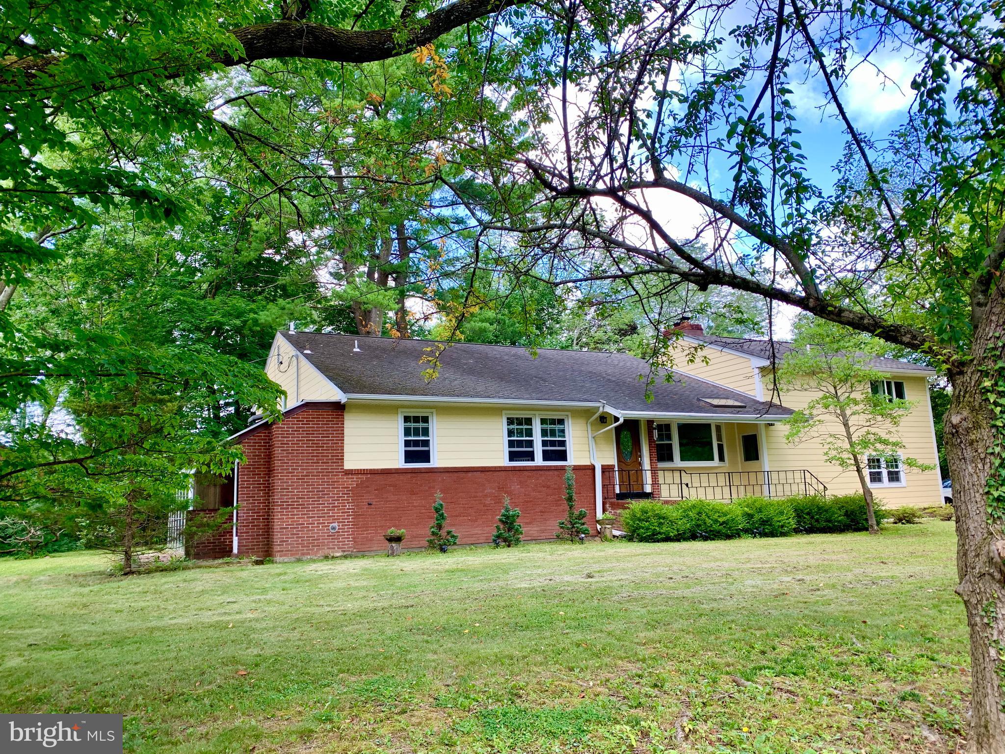 74 Marion Road East Princeton, NJ 08540 - Photo 3 of 32 a front view of a house with a garden