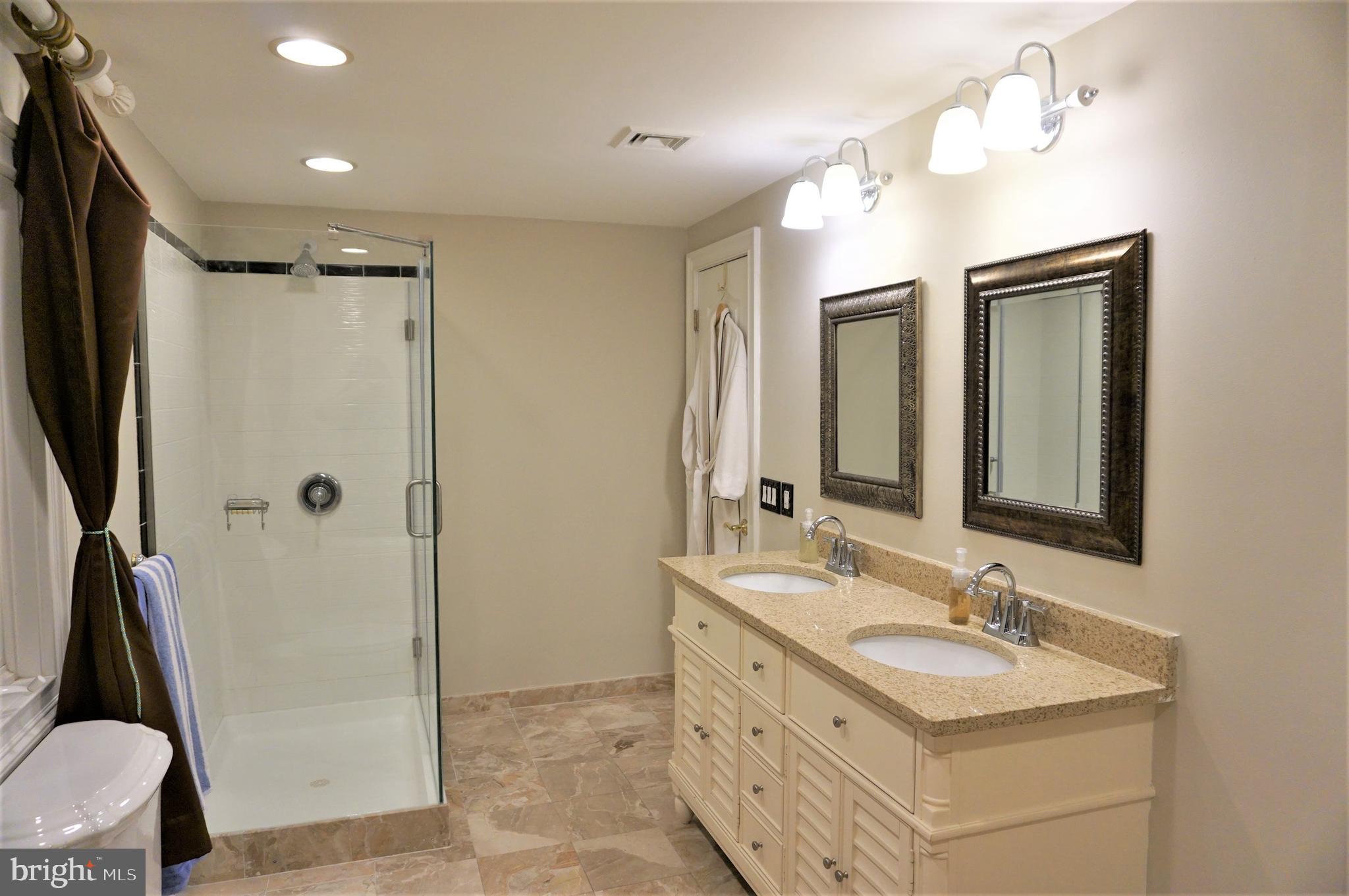 74 Marion Road East Princeton, NJ 08540 - Photo 25 of 32 a bathroom with a double vanity sink mirror double and shower