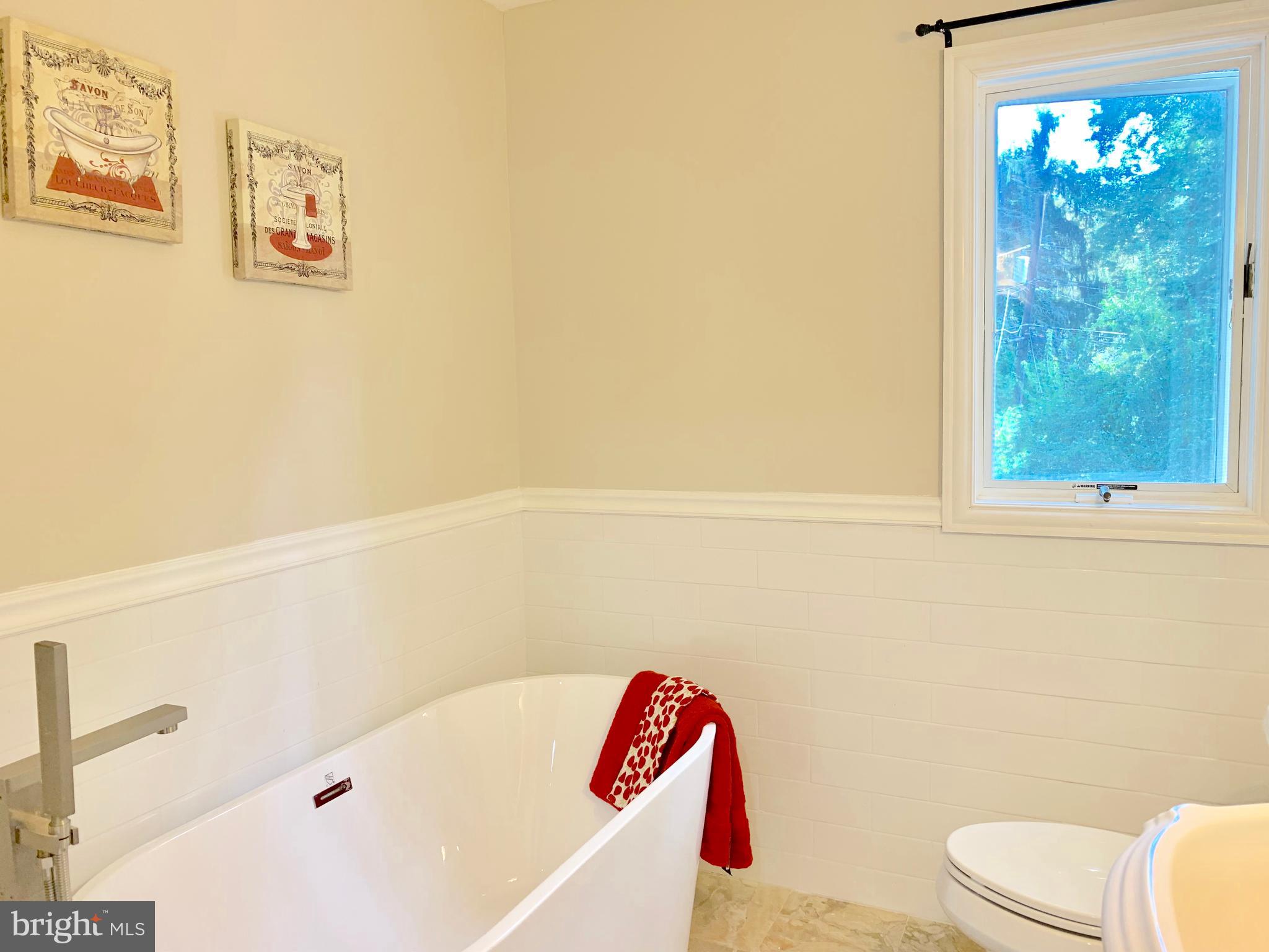 74 Marion Road East Princeton, NJ 08540 - Photo 29 of 32 a bathroom with a bathtub and a shower