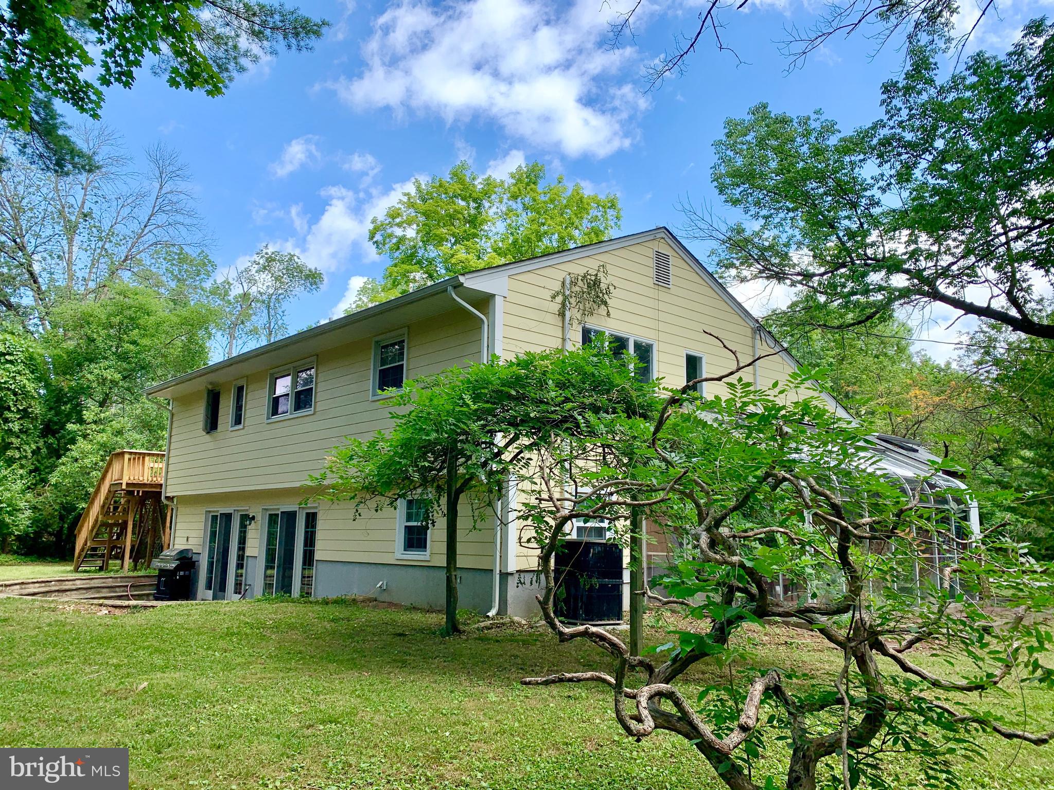 74 Marion Road East Princeton, NJ 08540 - Photo 6 of 32 a house that has a tree in front of it