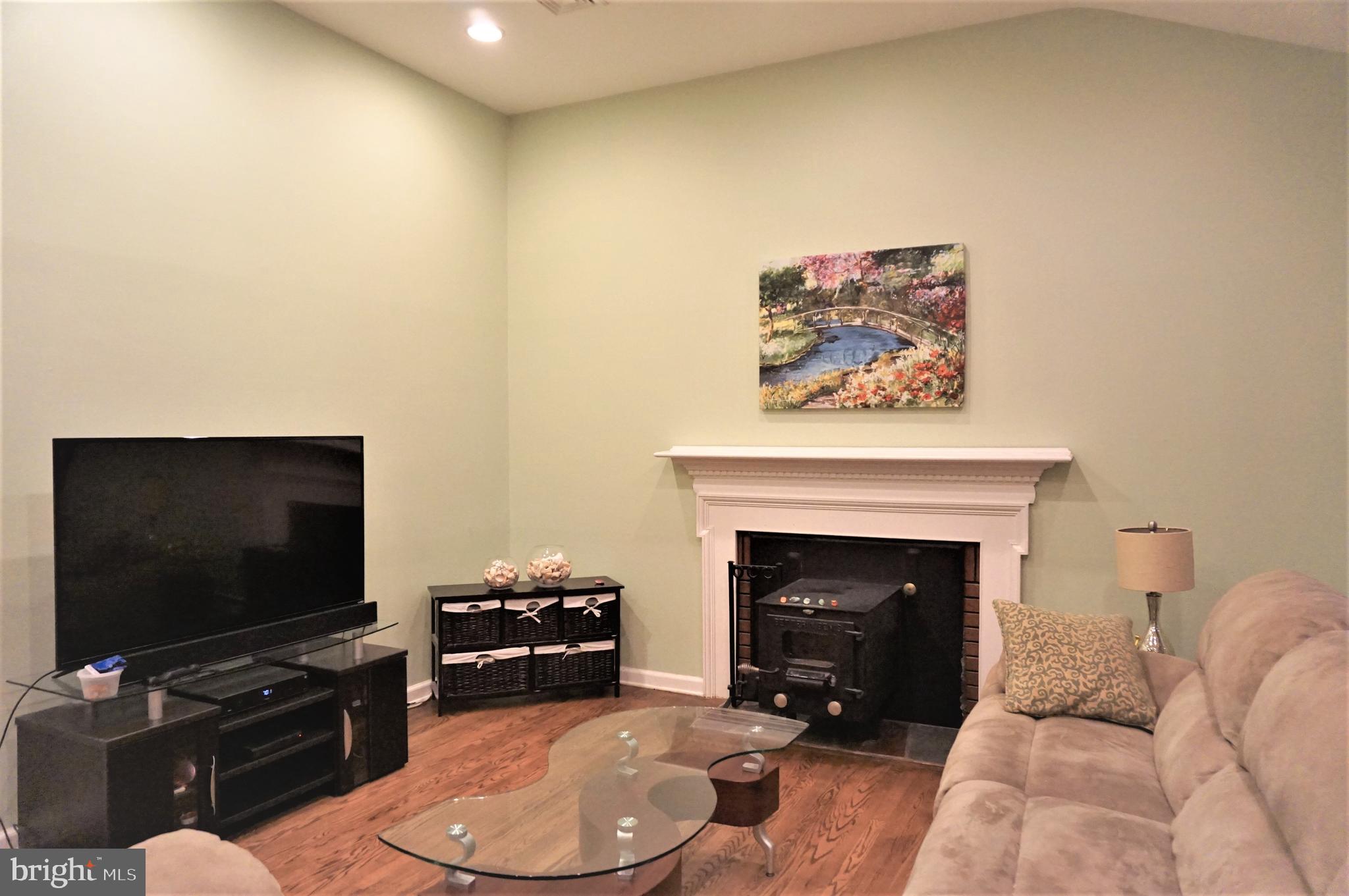 74 Marion Road East Princeton, NJ 08540 - Photo 7 of 32 a living room with furniture and a fireplace