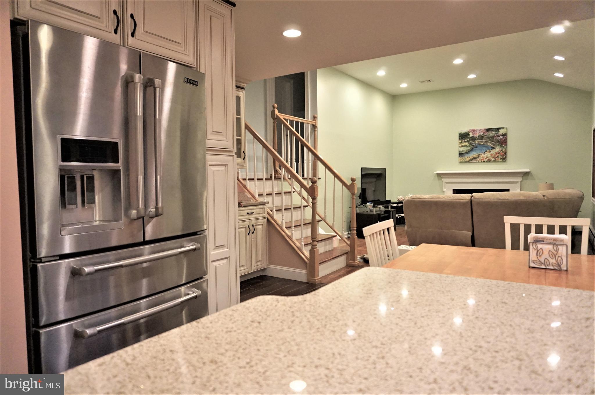 74 Marion Road East Princeton, NJ 08540 - Photo 9 of 32 a kitchen with stainless steel appliances kitchen island a refrigerator sink and cabinets