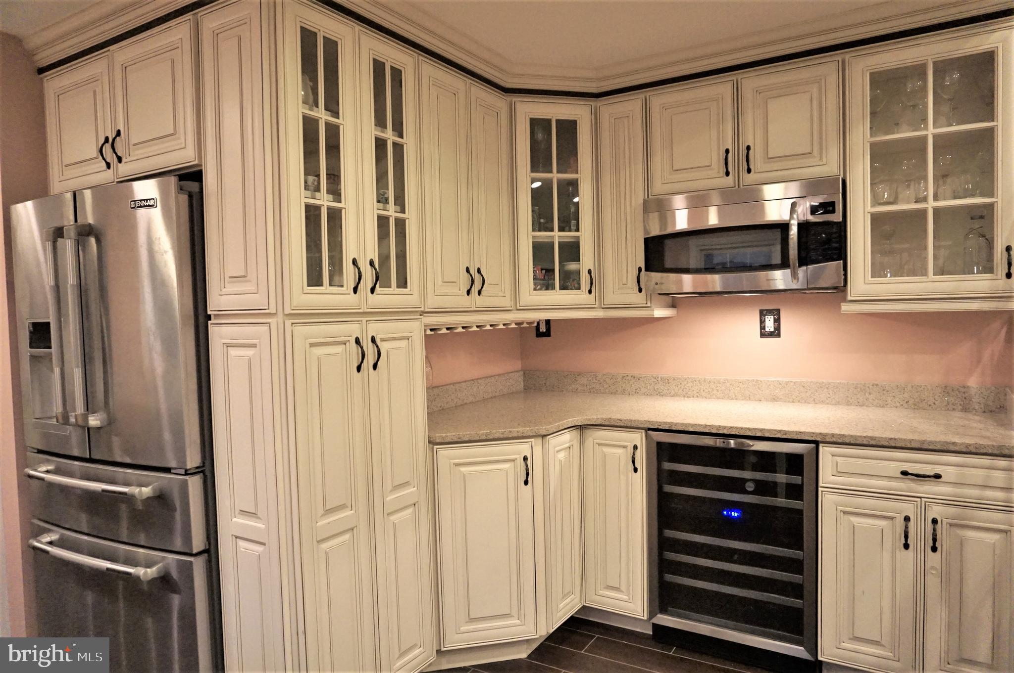 74 Marion Road East Princeton, NJ 08540 - Photo 10 of 32 a kitchen with stainless steel appliances a stove and a refrigerator