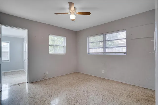 a view of a livingroom with a chandelier fan