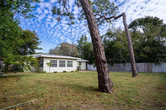 an aerial view of a house with outdoor space and street view