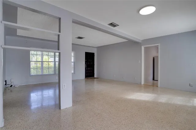 an empty room with windows