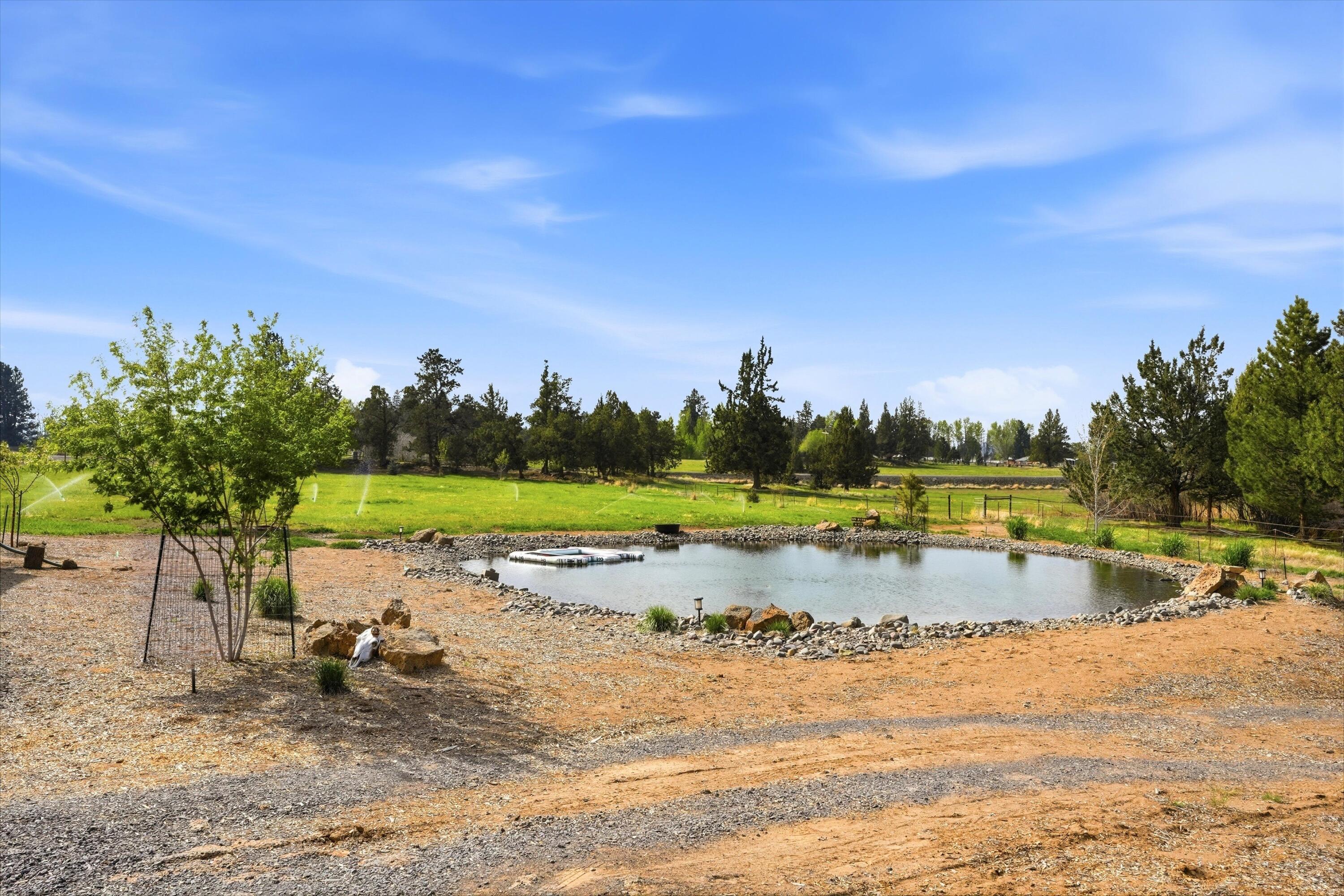61280 Larsen Road Bend, OR 97702 - Photo 46 of 58 a view of swimming pool with outdoor seating and yard in back