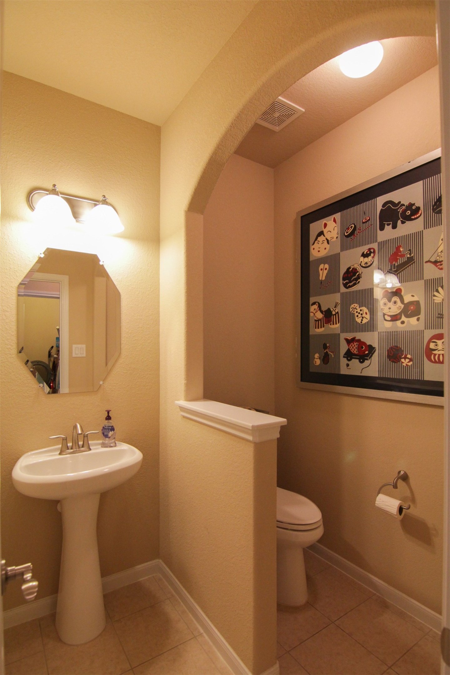 1423 Ralston Branch Way Sugar Land, TX 77479 - Photo 32 of 43 half bath: pedestal sink and toilet separated by archway and short wall