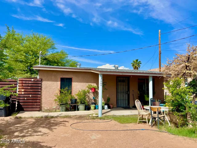 a view of house with outdoor space and porch