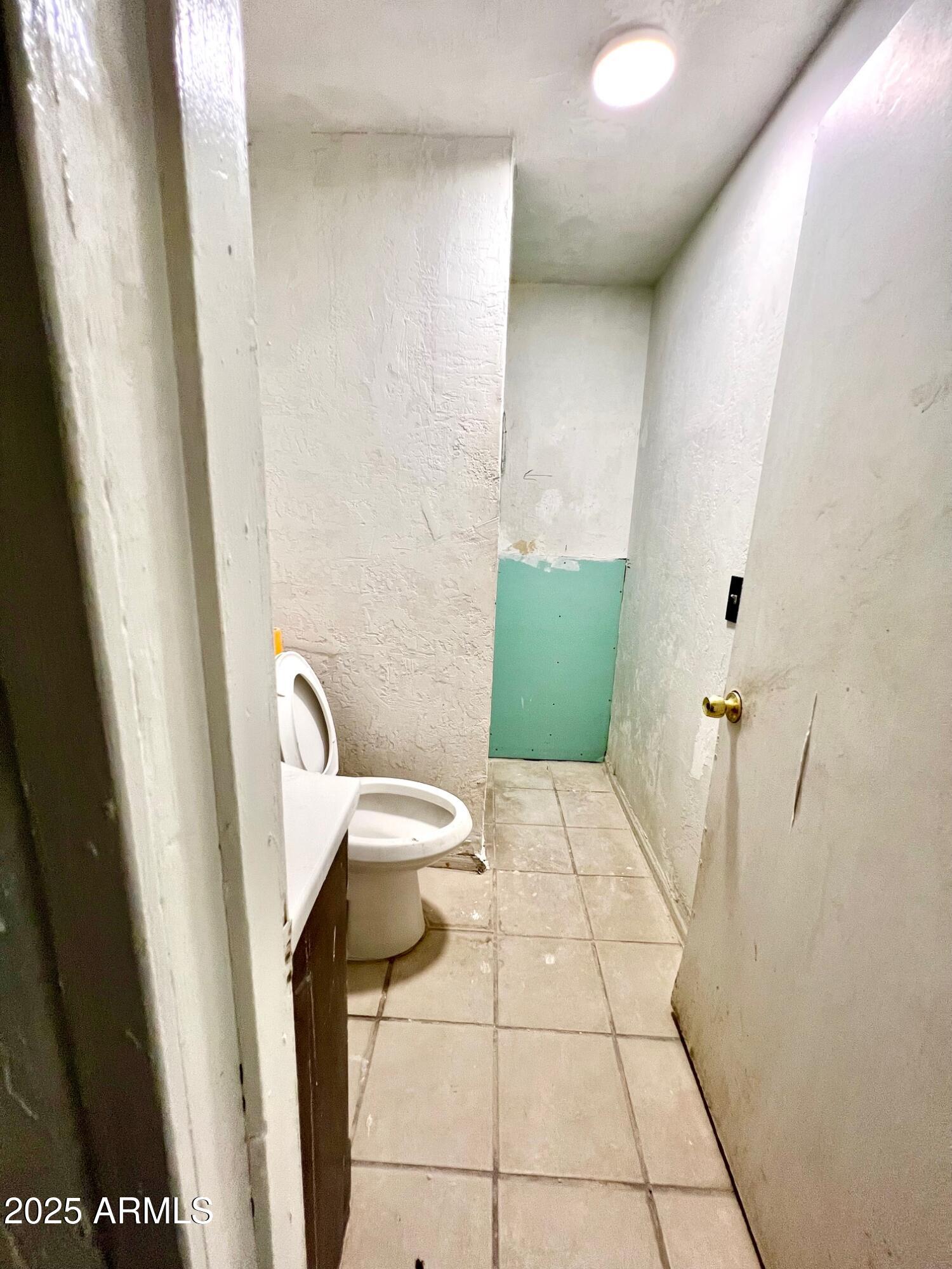 2002 West Lawrence Road Phoenix, AZ 85015 - Photo 11 of 22 a bathroom with a toilet and a sink