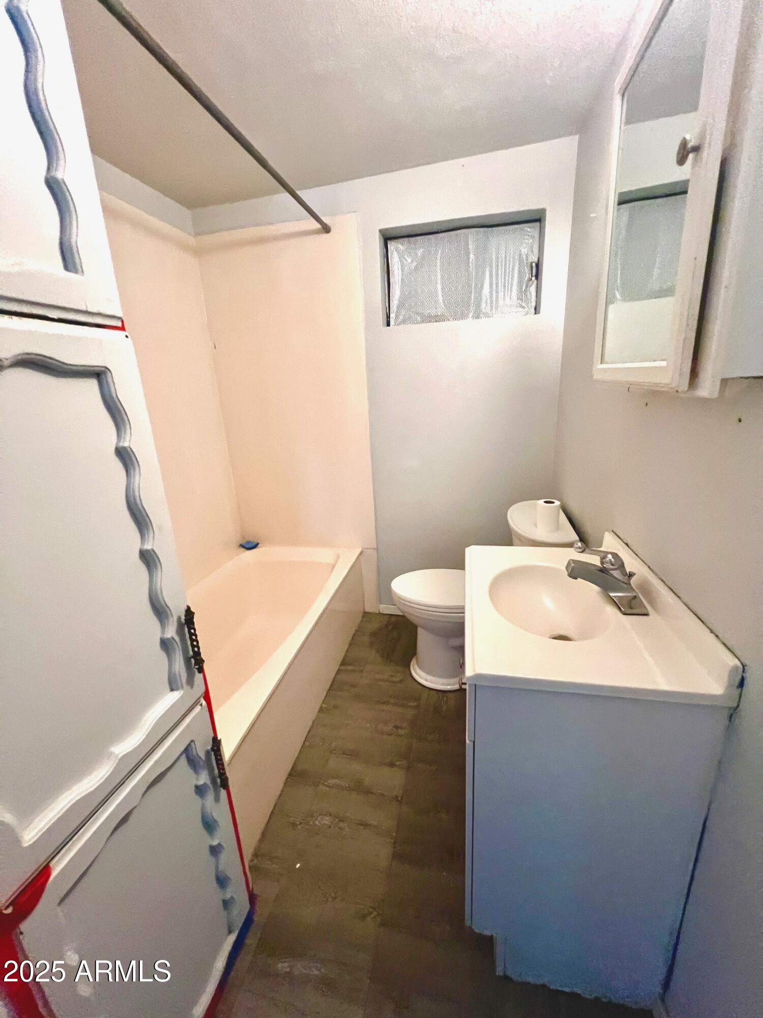 2002 West Lawrence Road Phoenix, AZ 85015 - Photo 18 of 22 a bathroom with a sink toilet and shower