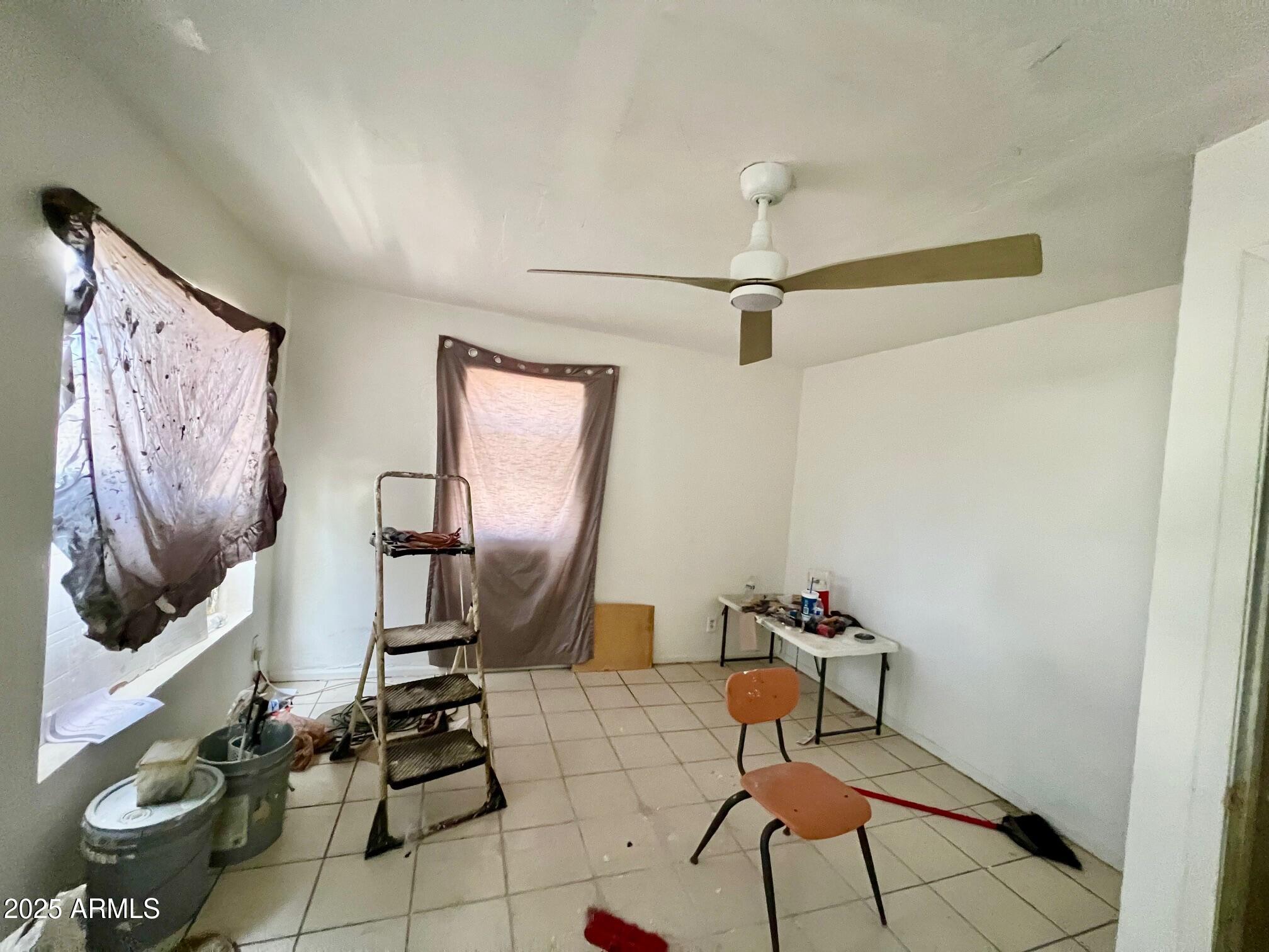 2002 West Lawrence Road Phoenix, AZ 85015 - Photo 10 of 22 a living room with furniture and a flat screen tv