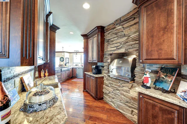 a en suite bathroom with a sink double vanity and a mirror