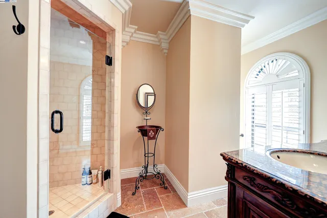 a bedroom with bed and a window