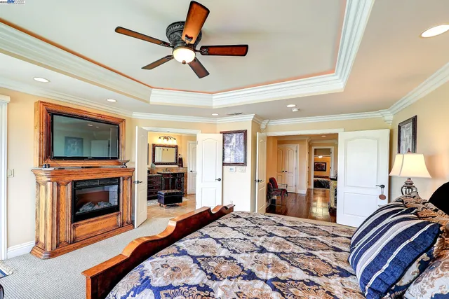 a large bathroom with a granite countertop tub and a large window