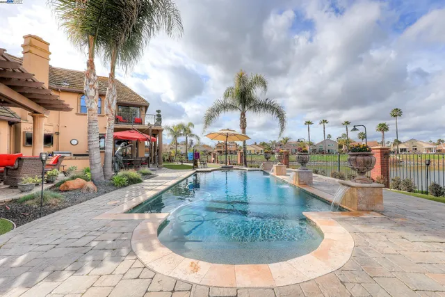 a view of a tables and chairs under an umbrella