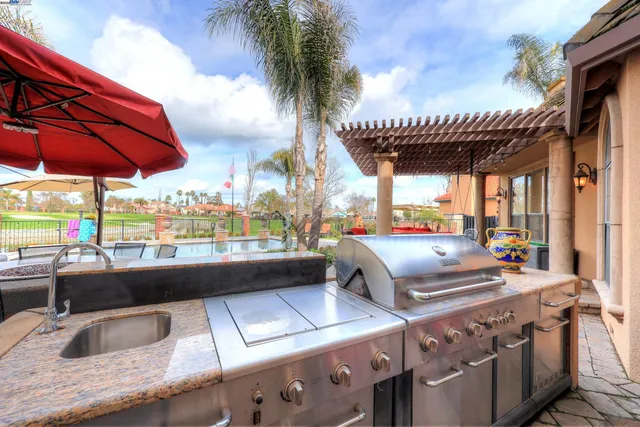 an aerial view of lake and residential houses with outdoor space