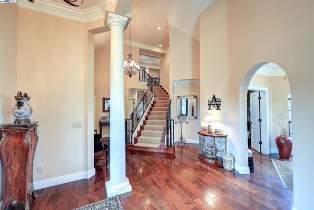 a view of a dining room with furniture and chandelier