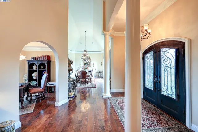 a view of a livingroom with furniture and a workspace