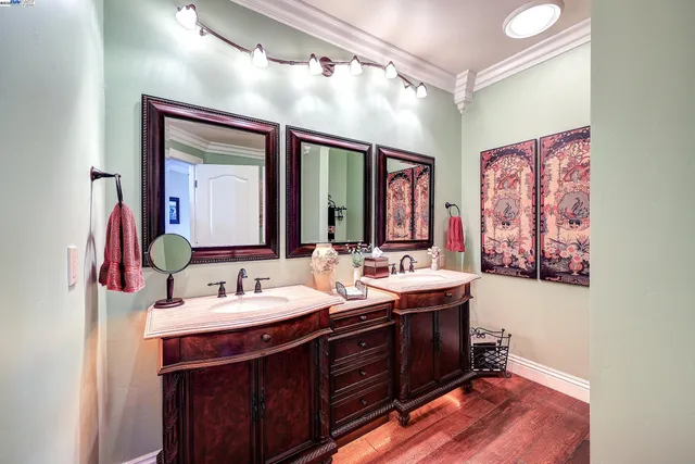 a bedroom with furniture and a chandelier fan