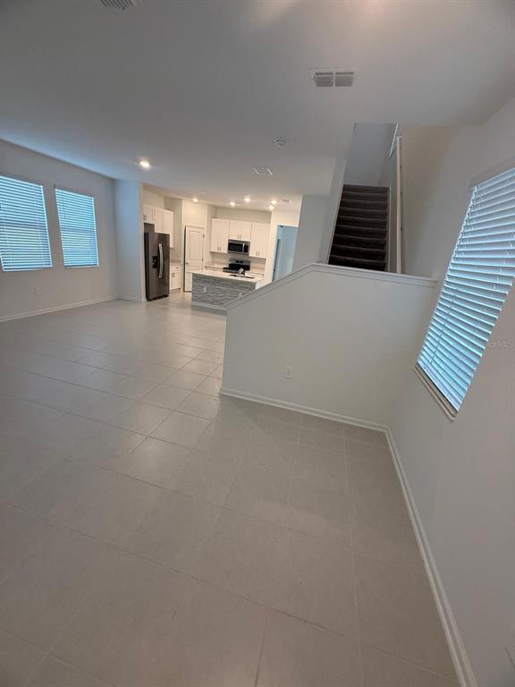 1770 Rider Rain Lane Apopka, FL 32703 - Photo 15 of 86 a view of a kitchen with a sink and a window